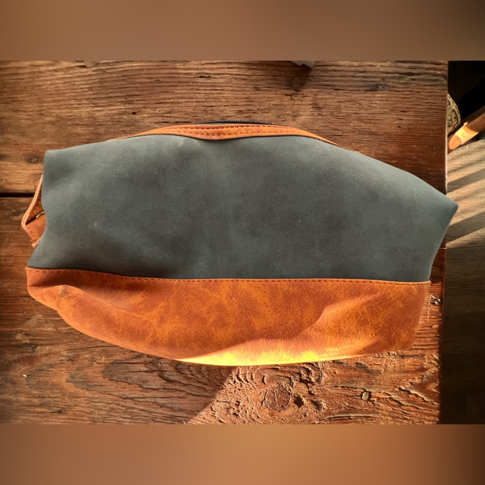 Choctaw Casino overnight toiletry bag.  Navy blue and deep brown faux leather.
